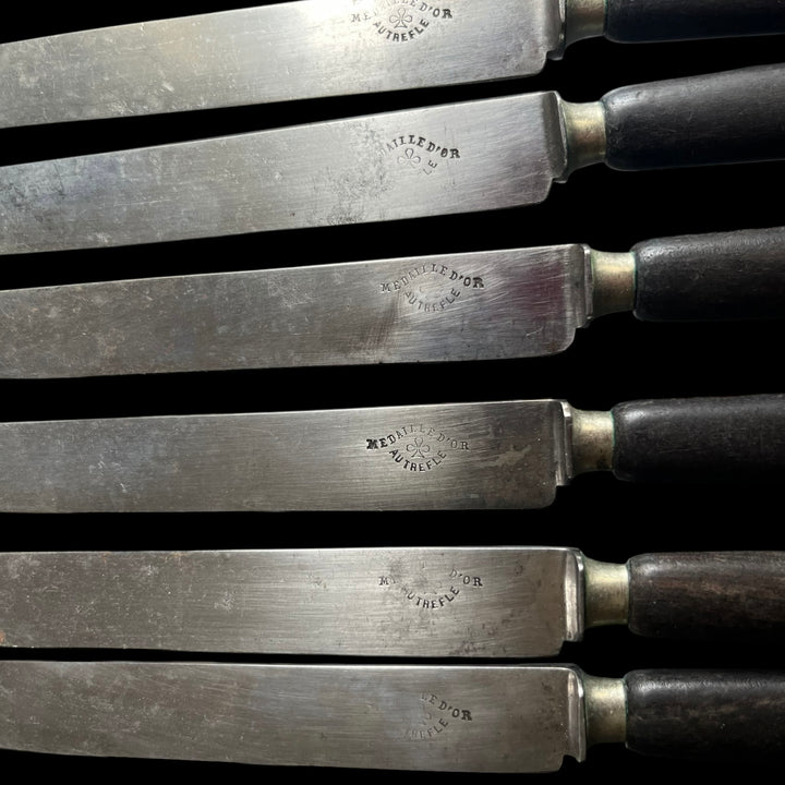 6 Ebony sleeve dessert knives and steel blade with gold medal clover