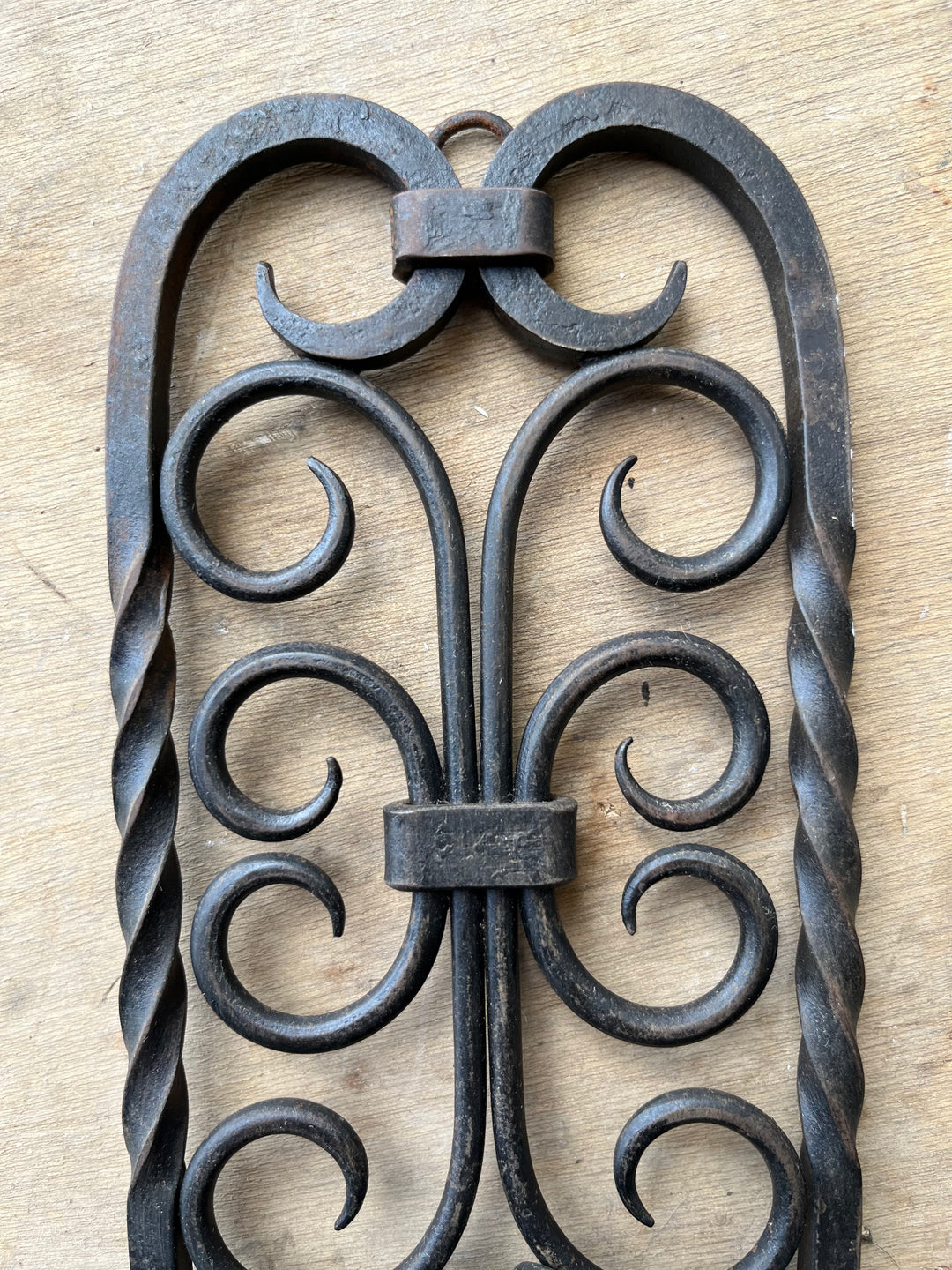 A double wrought iron wall lamp