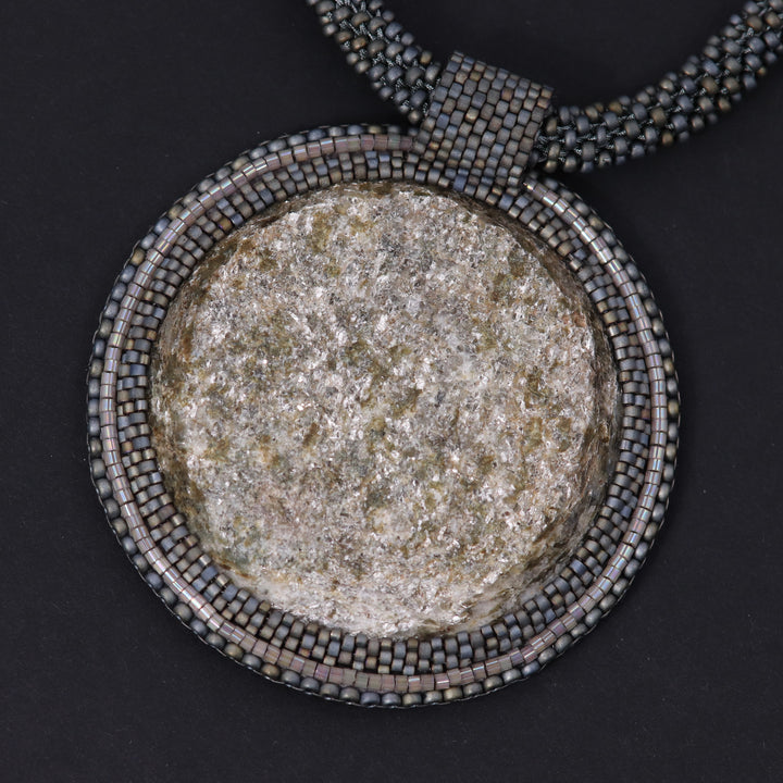 Embroidered necklace with mica schist (mica and garnet)