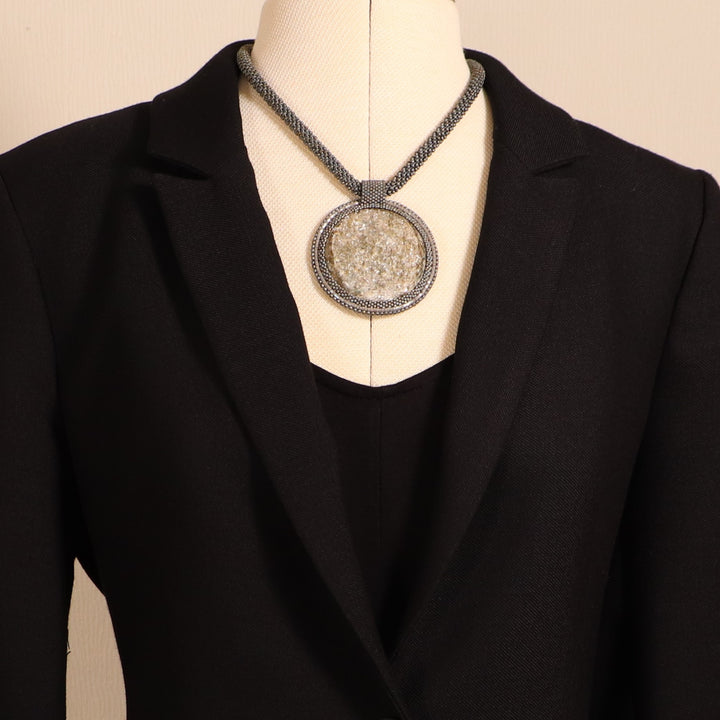 Embroidered necklace with mica schist (mica and garnet)