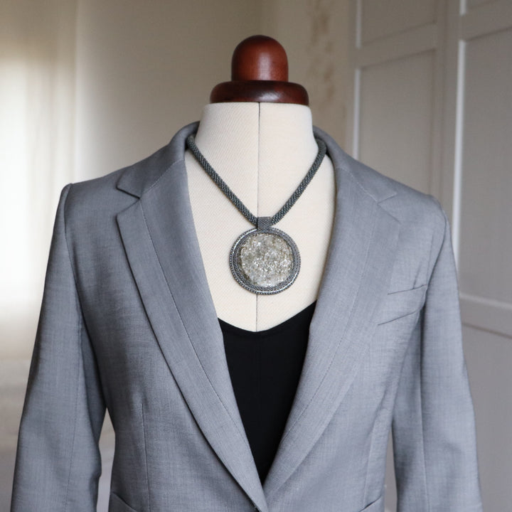 Embroidered necklace with mica schist (mica and garnet)