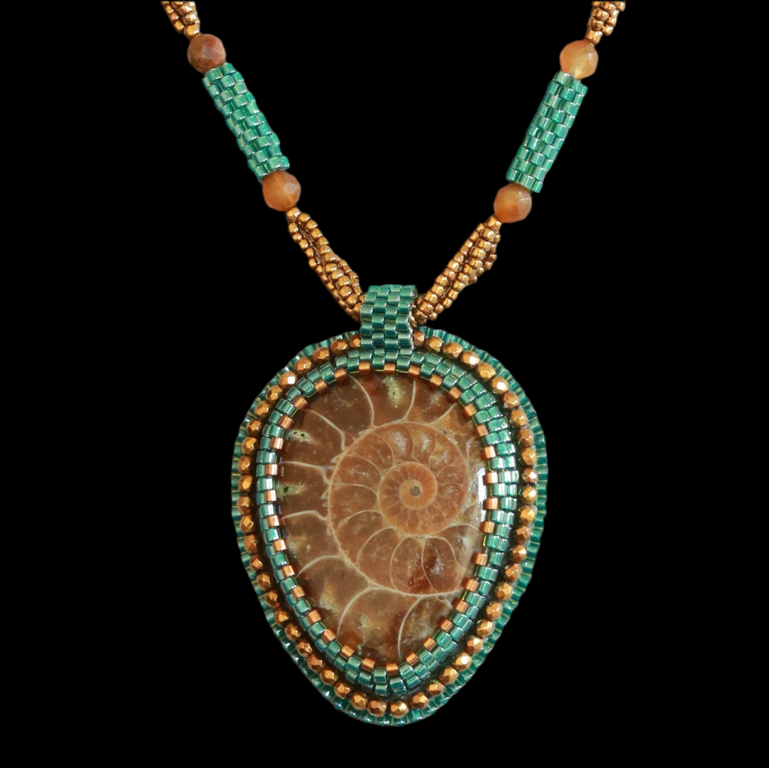 Embroidered necklace with ammonite and pyrite