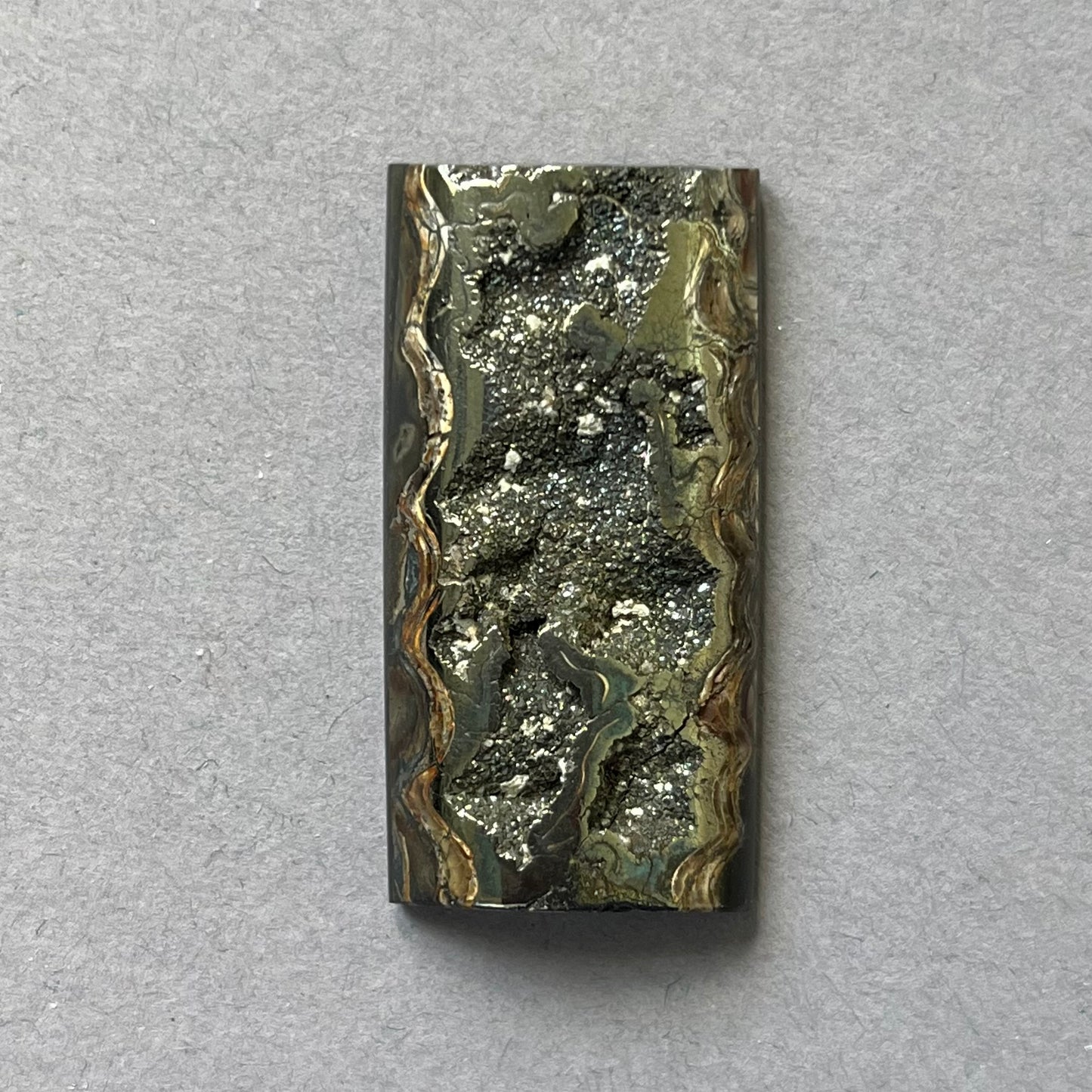 Pyritized ammonite, AM_P261, cabochon cut, 37x19x7 mm