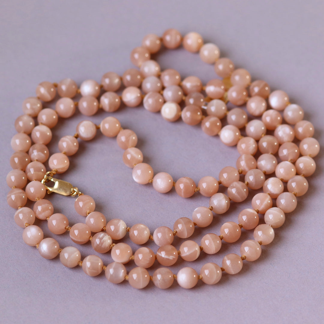 Long necklace with knots in natural stones (pink moonstone, Mala) 104 cm