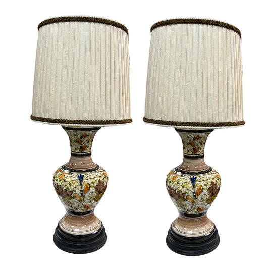 A pair of lamps with a pleated couture lampshade in wild silk