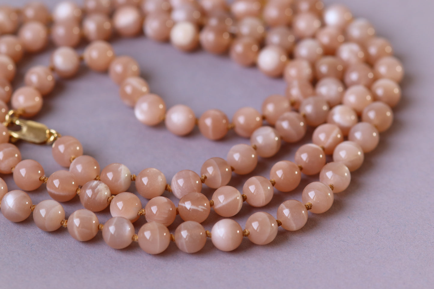 Long necklace with knots in natural stones (pink moonstone, Mala) 104 cm