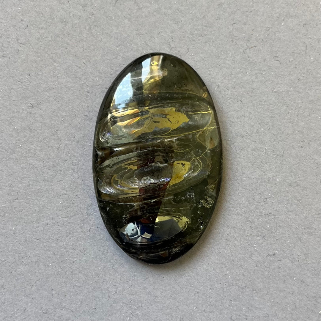 Pyritized ammonite, AM_P205, cabochon cut, 45x27x7 mm