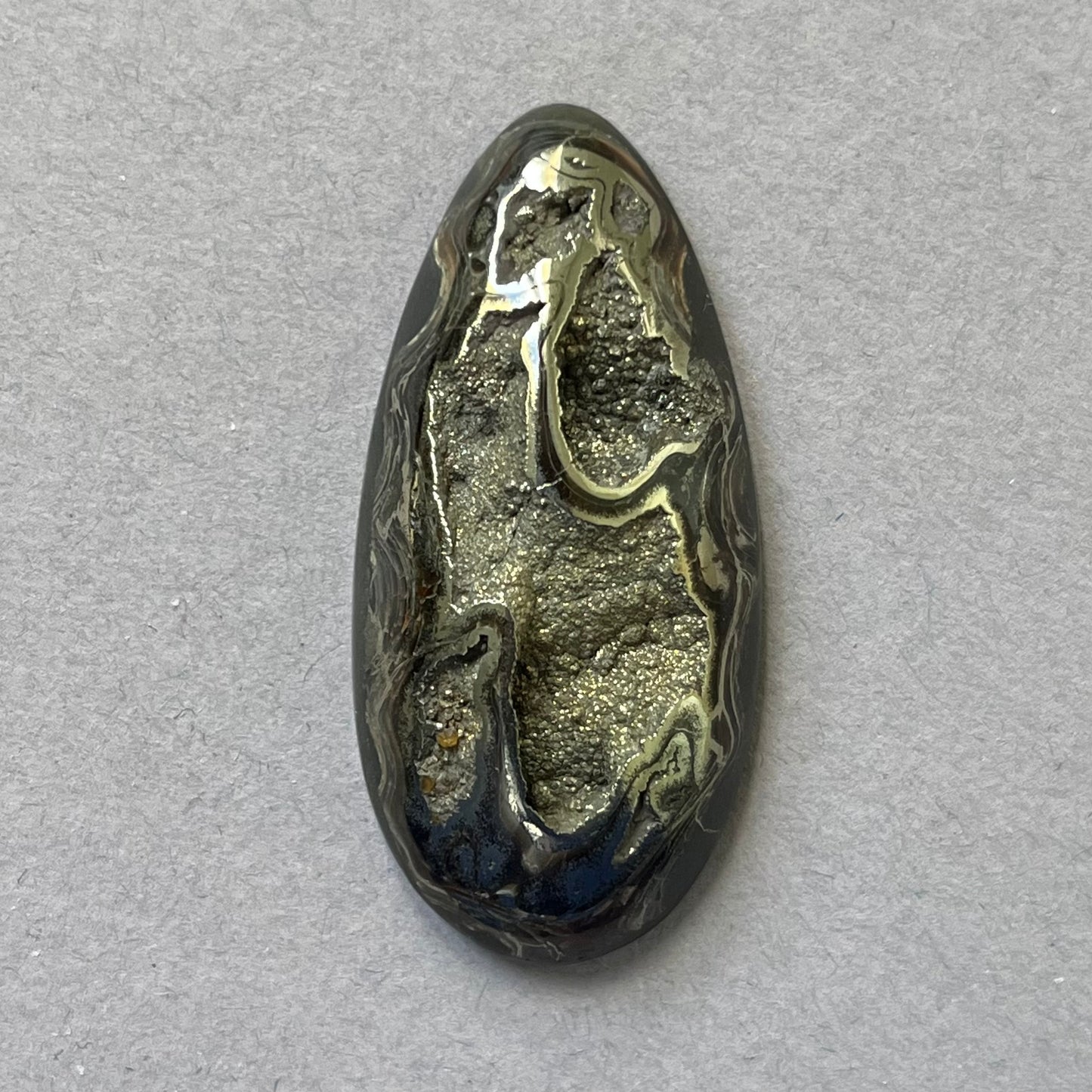 Pyritized ammonite, AM_P264, cabochon cut, 43x21x9 mm