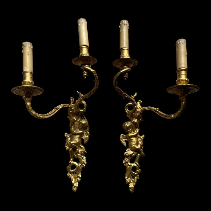 Paire appliques 2 bras lumière style Régence bronze doré putti angelots