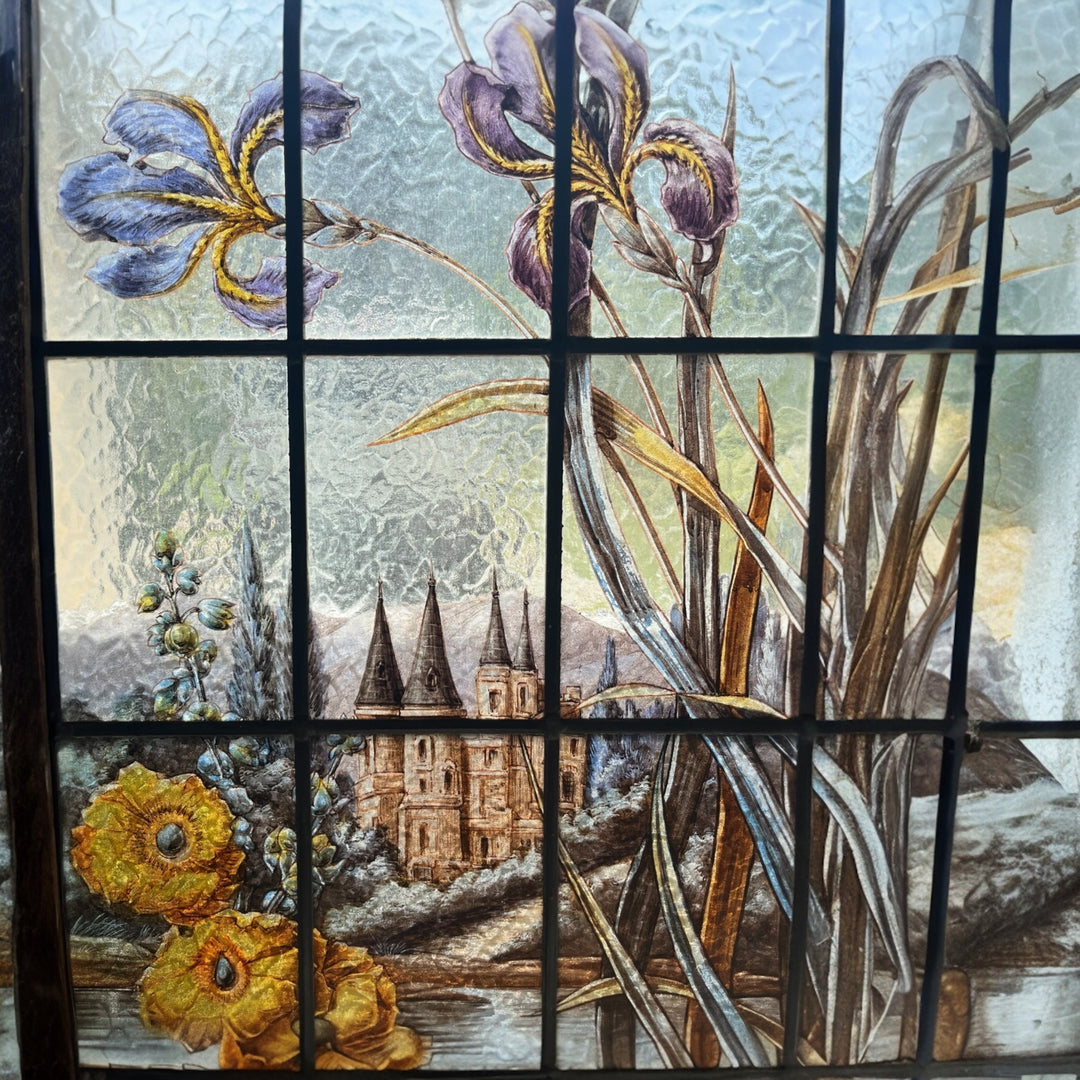 Art Nouveau stained glass window with irises and Loire Castle