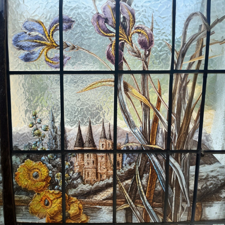 Art Nouveau stained glass window with irises and Loire Castle