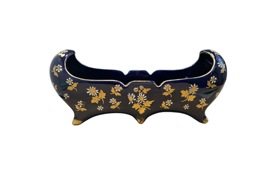 Midnight blue planter with golden flowers