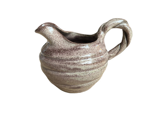 Vern -shaped jug with twisted handle signed AC No1