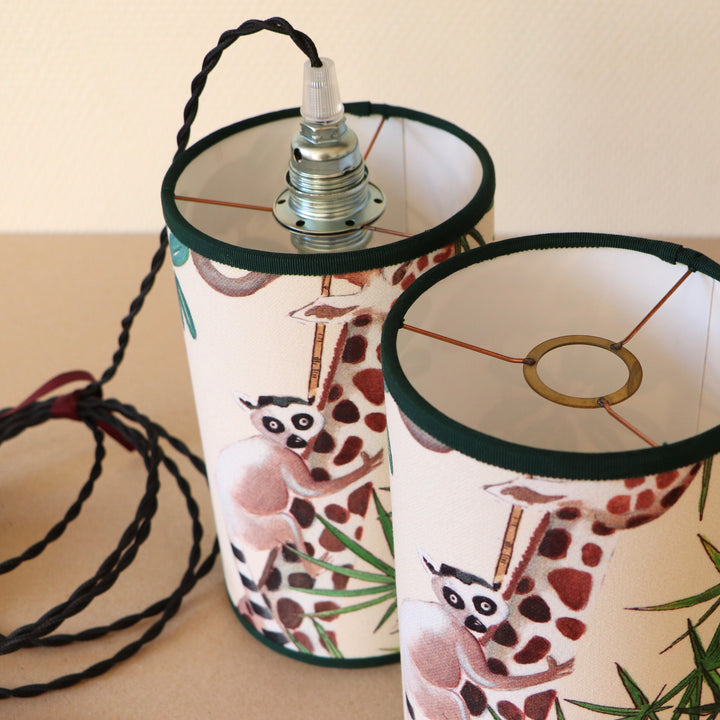 Portable lamp with a laminated lampshade in LEMOURS fabric