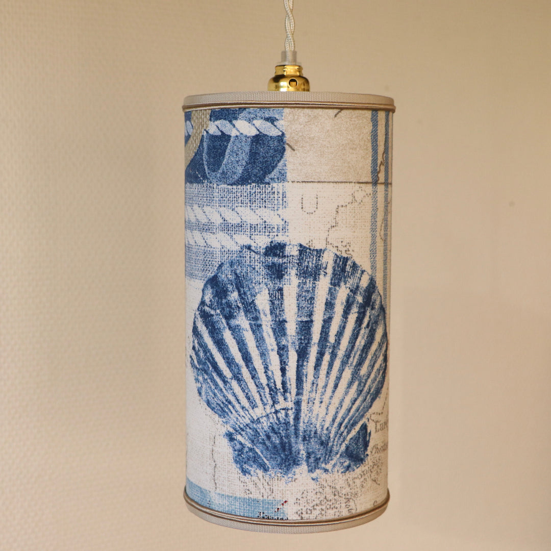 Portable lamp with a laminated lampshade in COQUILLE fabric