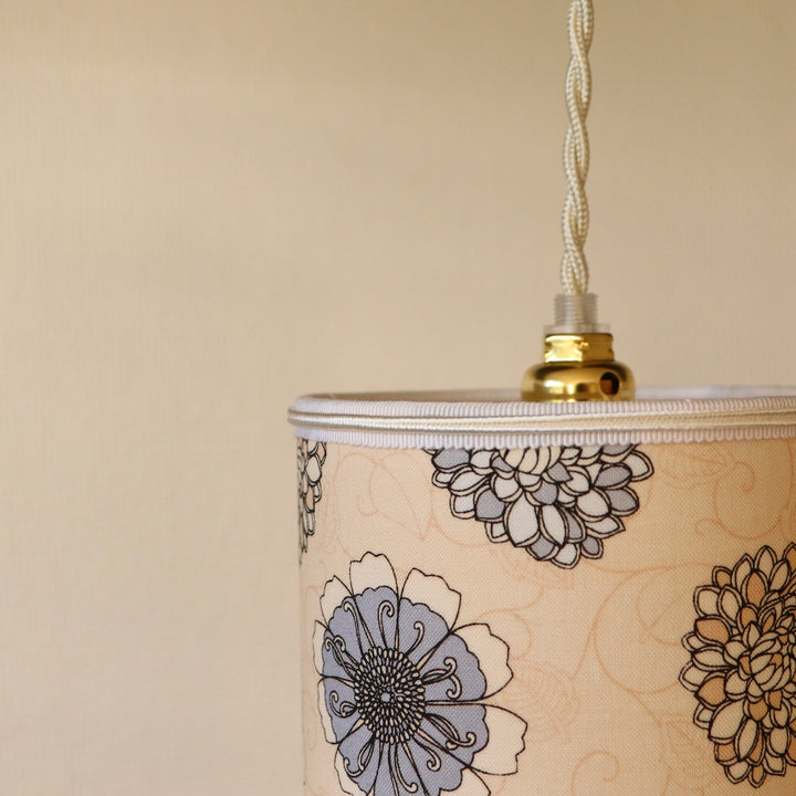 Portable lamp with a laminated lampshade in gray and beige FLOWERS fabric