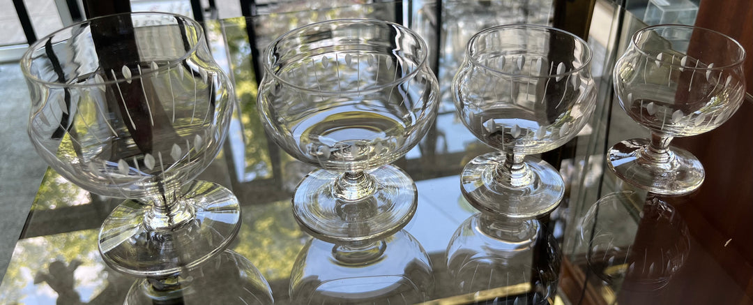 Service of 43 glasses and 2 art deco cut crystal carafes