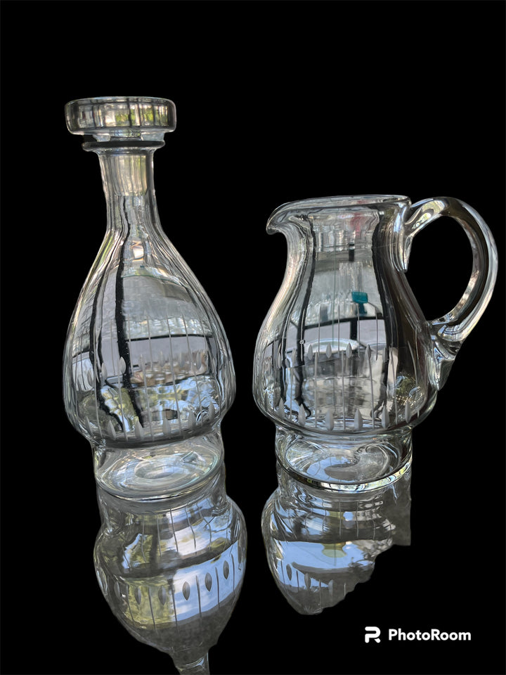 Service of 43 glasses and 2 art deco cut crystal carafes