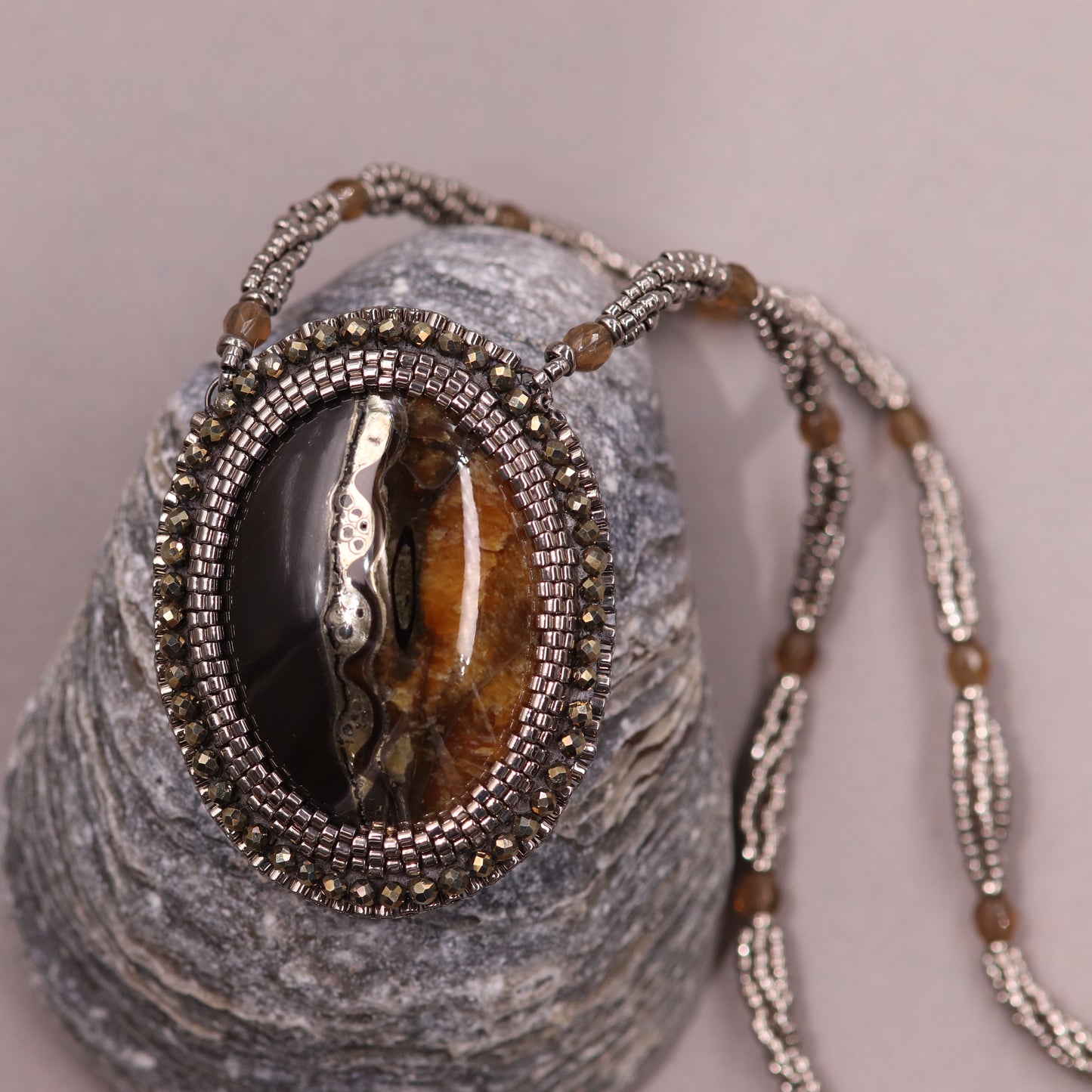 Necklace with pyritized ammonite and yellow calcite