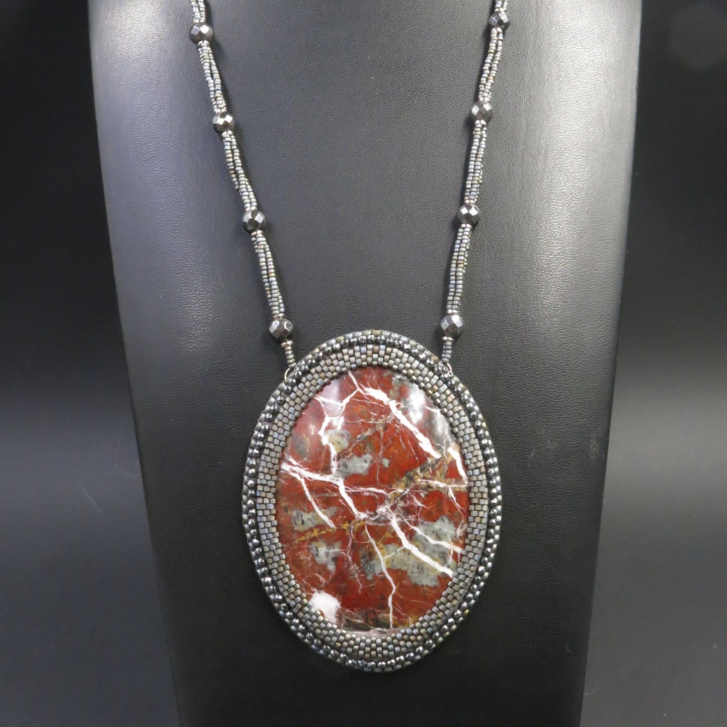 Embroidered necklace with red jasper