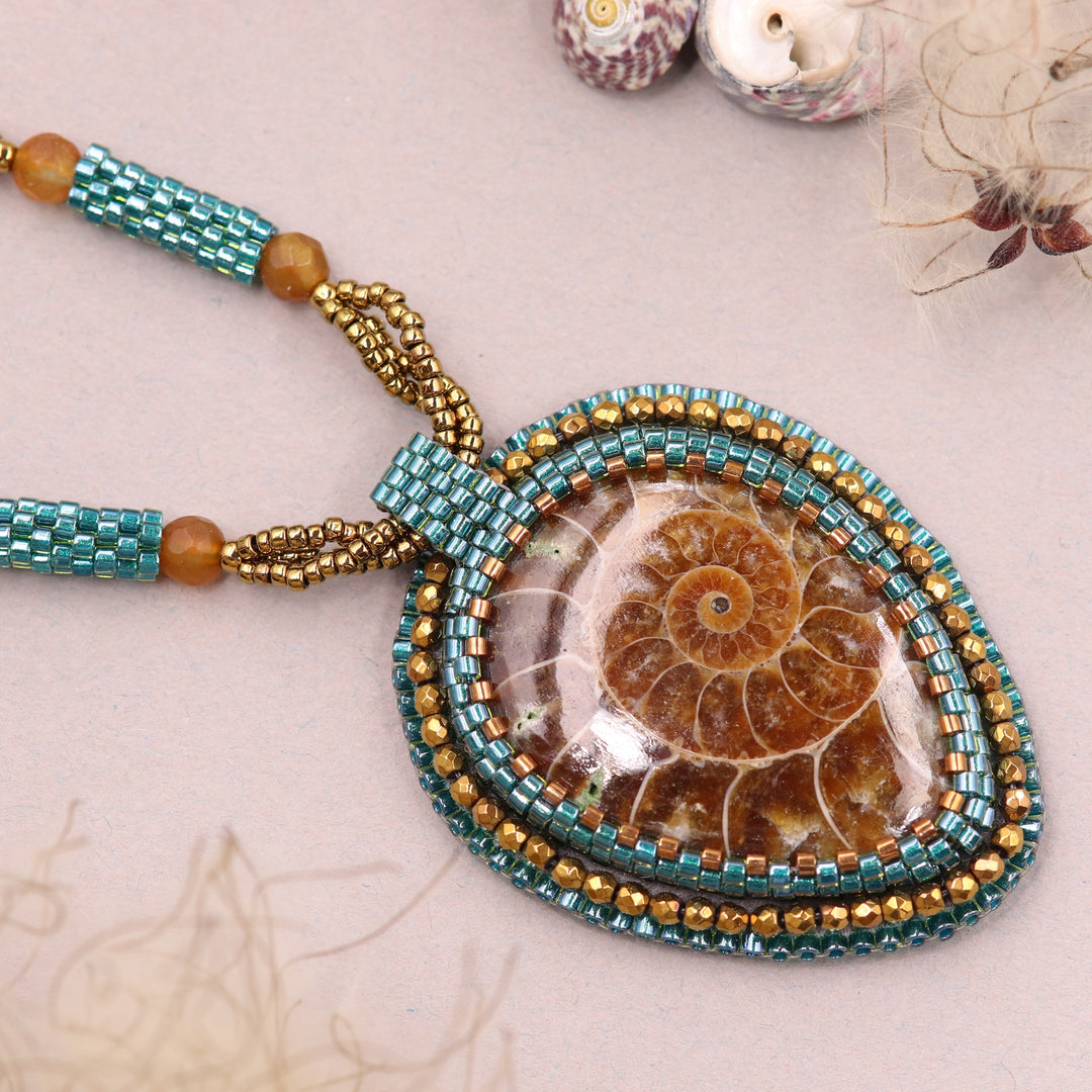 Embroidered necklace with ammonite and pyrite