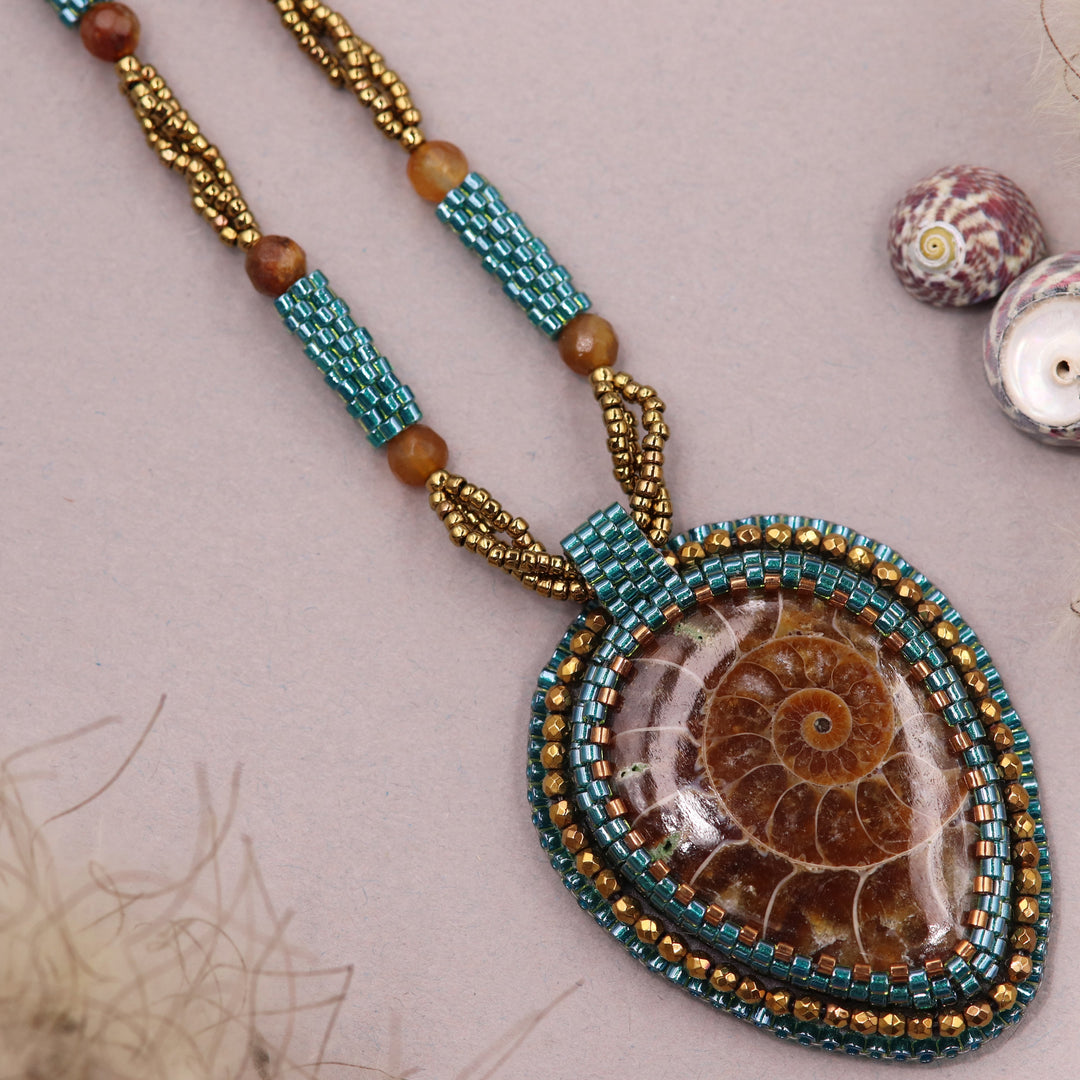 Embroidered necklace with ammonite and pyrite