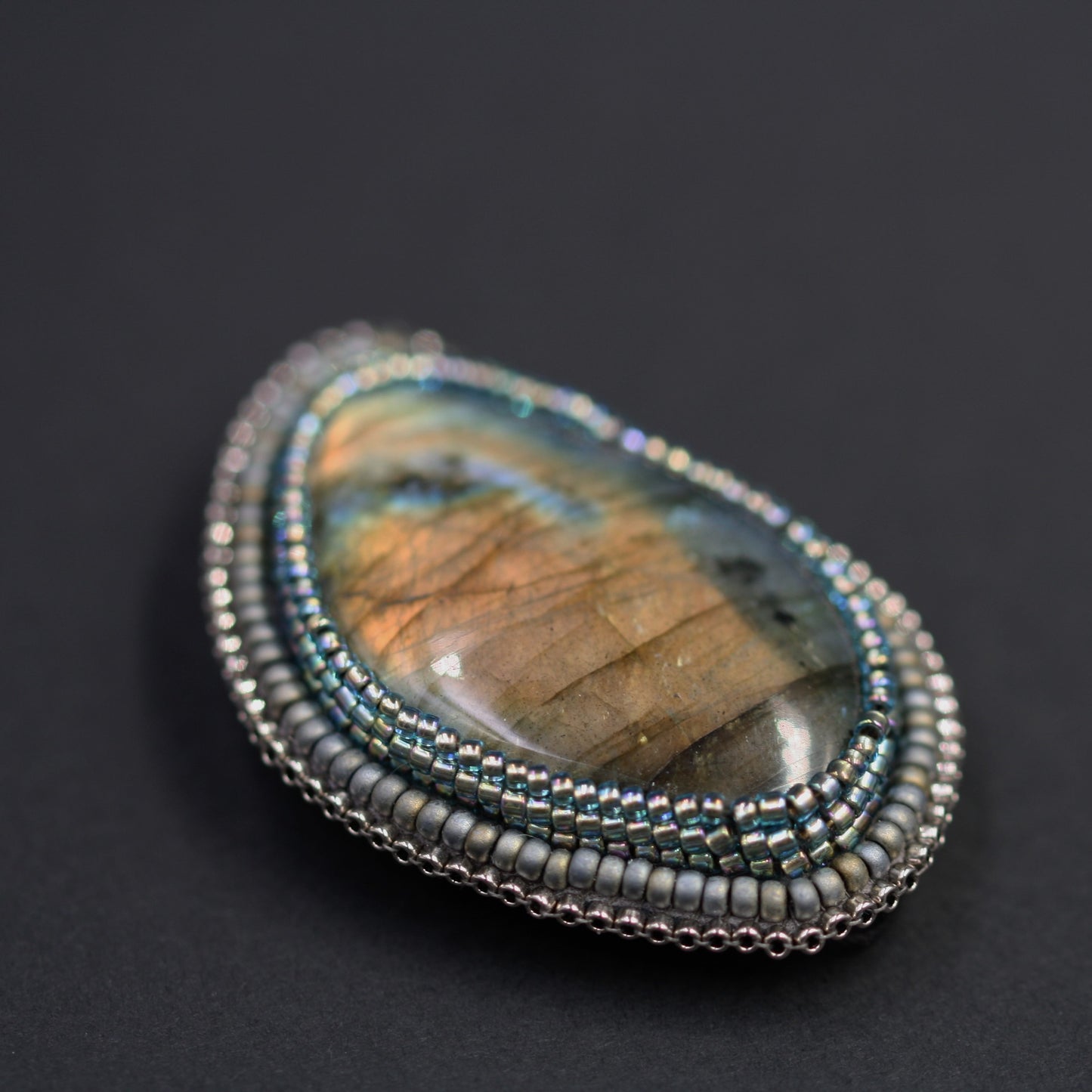 Embroidered brooch, labradorite