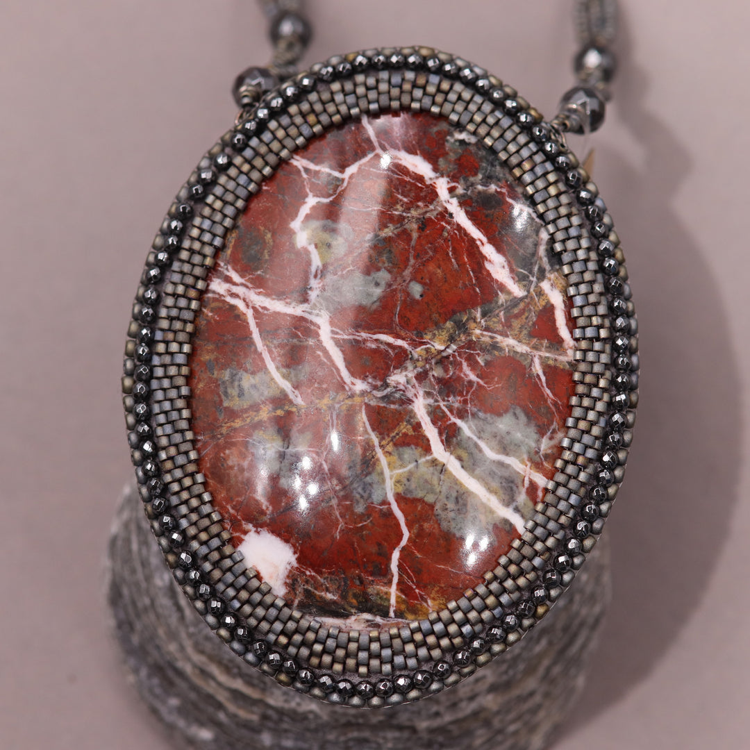 Embroidered necklace with red jasper