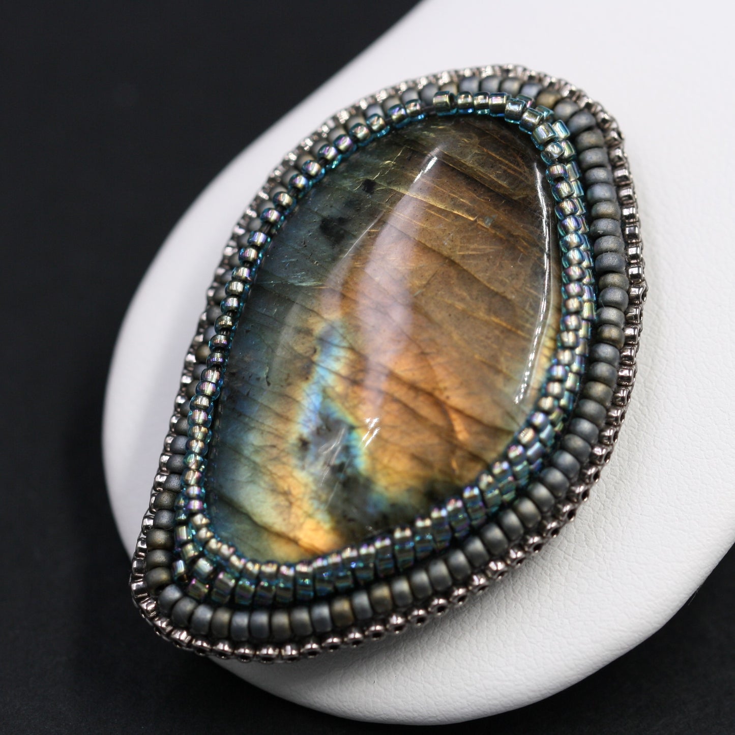 Embroidered brooch, labradorite