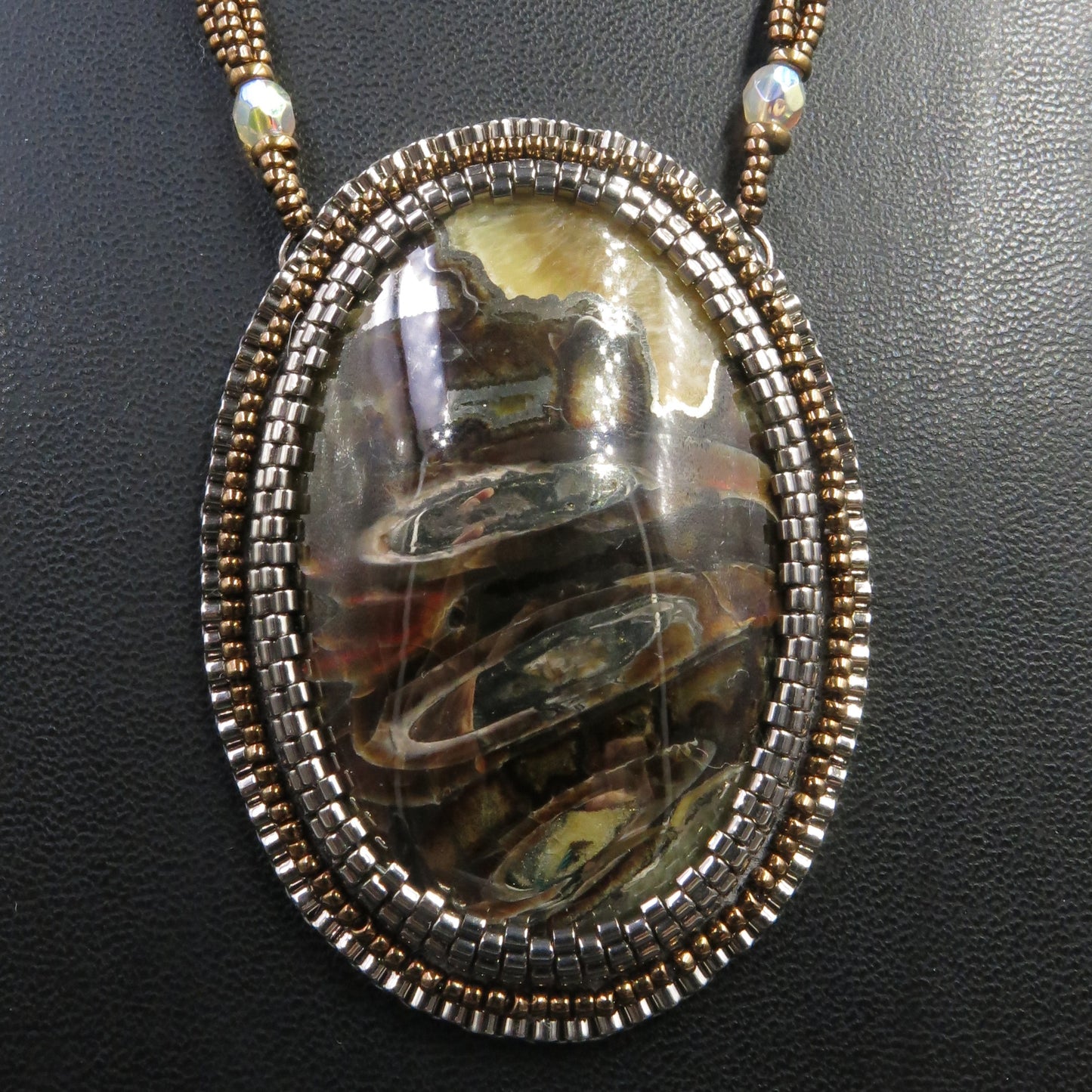 Embroidered necklace with pyritized ammonite, yellow calcite, ammolite CLB14