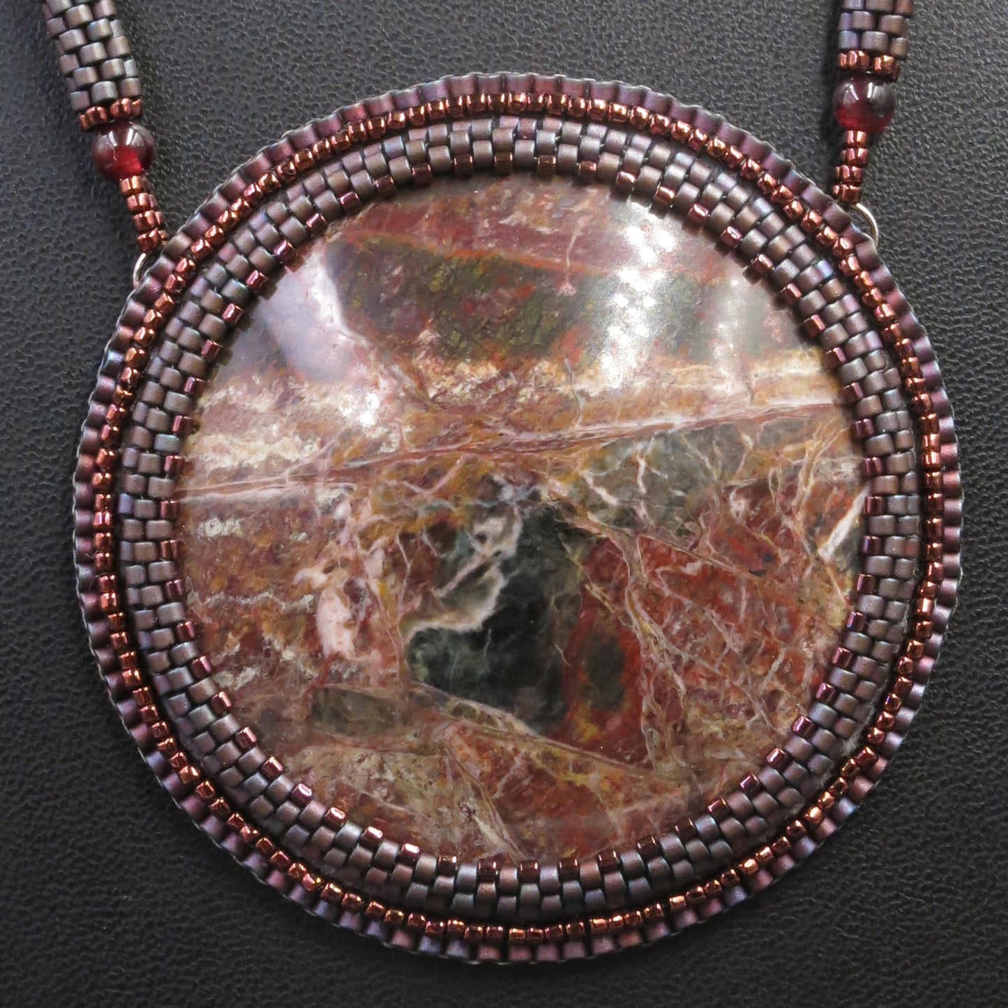 Embroidered necklace with listwaenite and coffee jasper